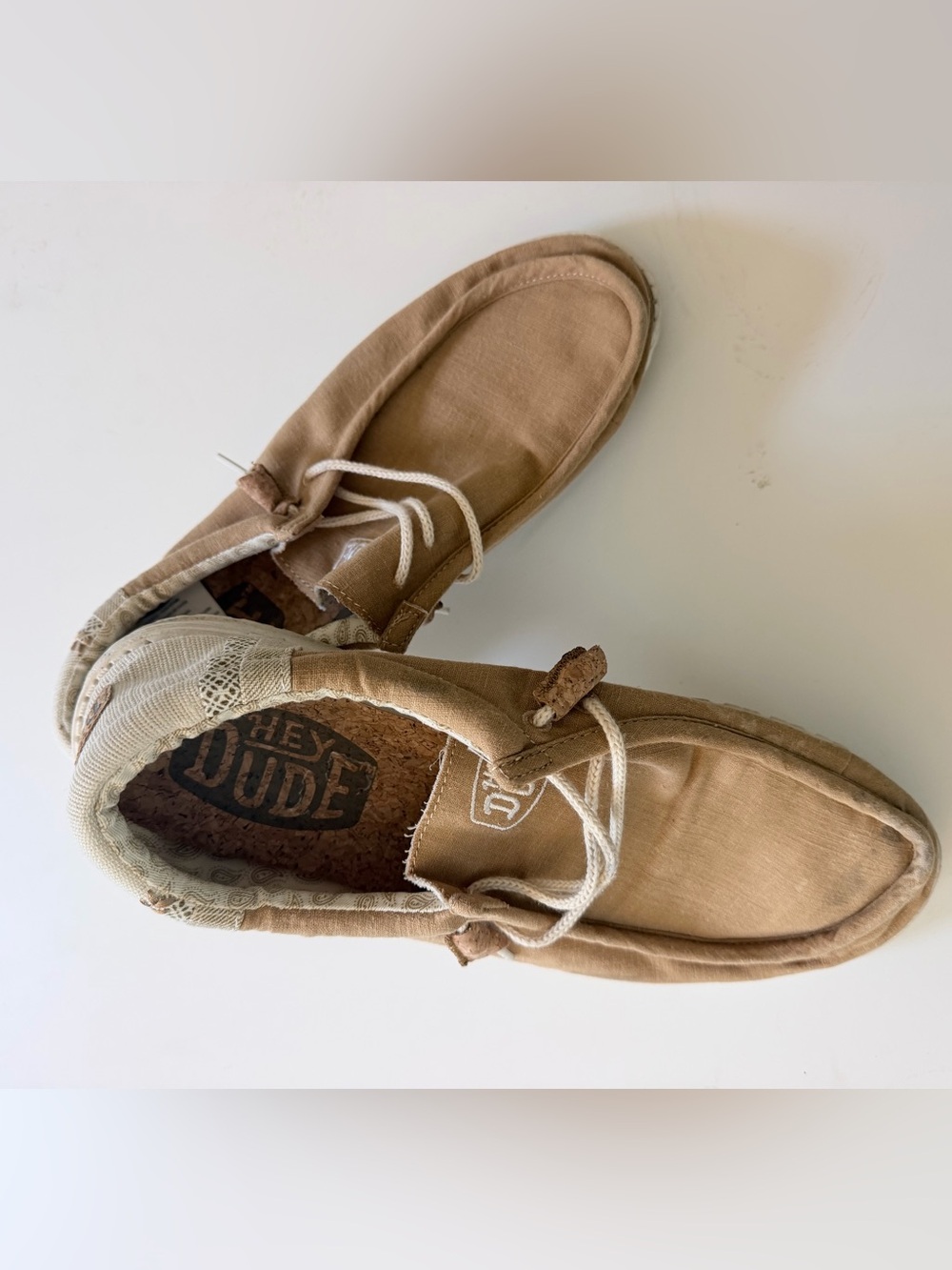 HEY DUDE Wally Break Stitch slip-on shoes in a neutral beige color